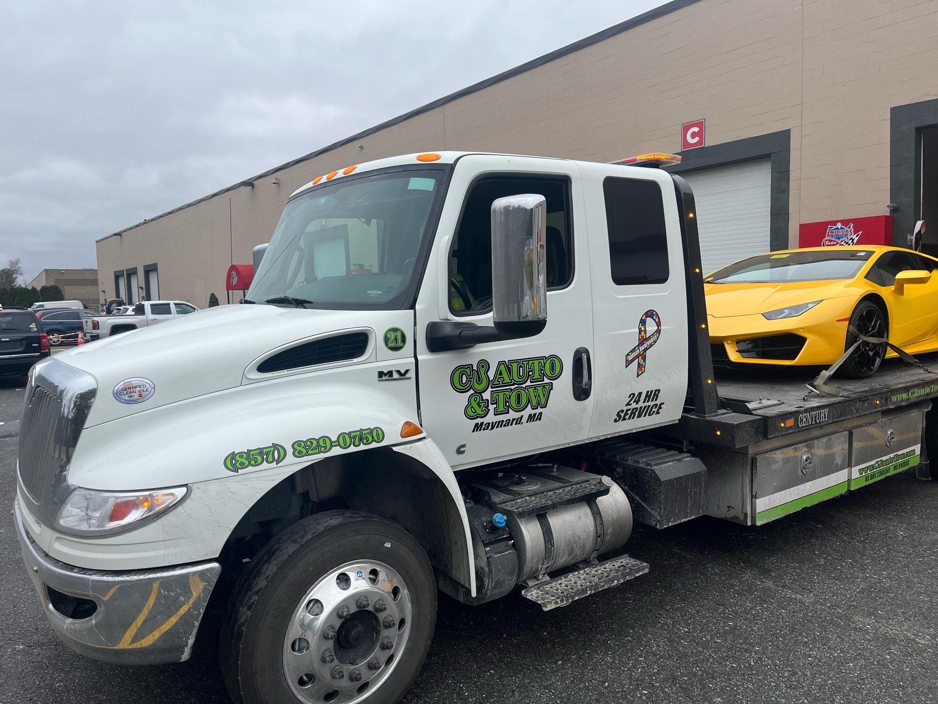 CJ Auto & Tow Truck 21 transporting a yellow Lamborghini Huracán — Maynard MA